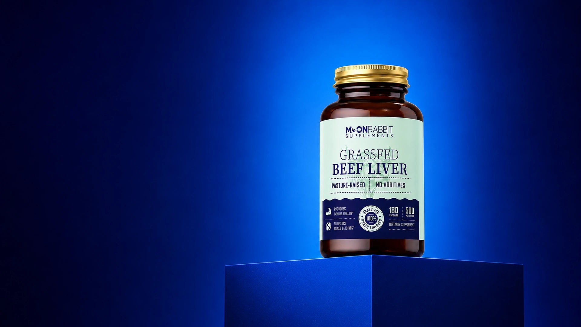 Bottle of grassfed beef liver supplement on a blue background